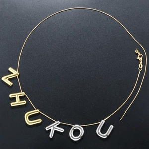 Polished puffy balloon letter ZHUKOU necklace in two-tone gold and silver finish
