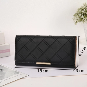 Detailed view of black quilted wallet with dimensions 19cm by 9.5cm and 3cm depth