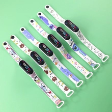 Set of six colorful cartoon digital pocket watches with white straps on a green background