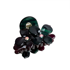 Deep green and red acetate flower hair claw clip with sparkling rhinestone center