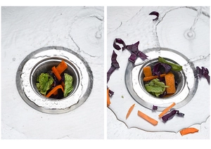 Detailed view of round stainless steel sink strainer catching food waste in water flow