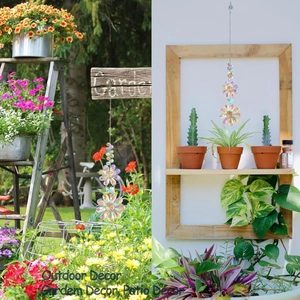 Detail of outdoor crystal flower suncatcher with rainbow prism hanging in a lush garden