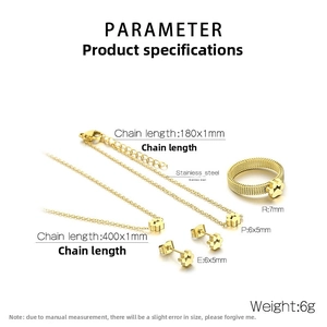 Detail of gold-plated stainless steel jewelry set with paw prints including necklace and ring