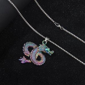 Rainbow stainless steel dragon totem necklace with iridescent finish on a dark background
