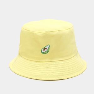 Close-up of cute avocado embroidery on a vibrant yellow cotton bucket hat texture