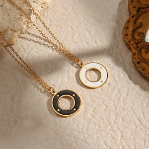 Minimalist gold circle pendant necklaces with black and white starburst drip oil patterns