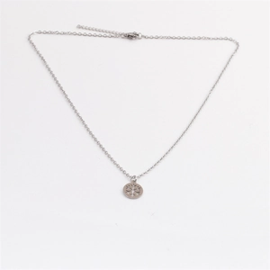 Polished stainless steel snowflake pendant necklace with adjustable chain on white background