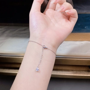Close-up of S925 sterling silver bracelet with water drop zircon on a model's wrist