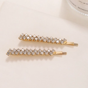 Pair of gold rhinestone hair clips featuring elegant double-row crystals for weddings
