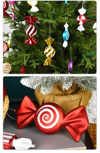 Detail of red spiral Christmas candy ornaments on tree with rustic background