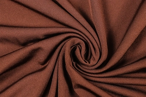 Detailed macro view of dark brown high-elasticity ribbed knit fabric with soft texture