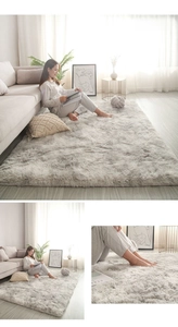 Close-up of greyish white long plush rug showing soft fluffy texture and modern fiber detail