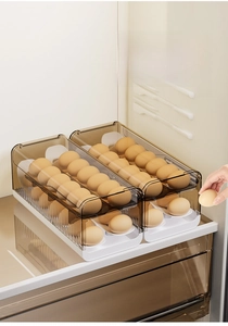 Macro view of double-layer translucent brown egg storage box for kitchen fridge