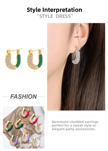 Detailed view of U-shaped gold earrings with crystal pavé and colorful enamel finish
