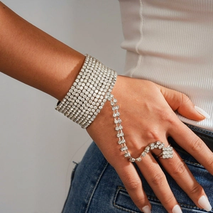 Detailed macro view of silver slave bracelet with sparkling rhinestones on hand