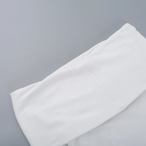 Close-up of white ribbed knit fabric texture on a slim-fit off-shoulder top for women