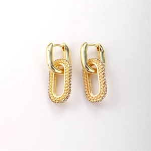 Detailed close-up of 18K gold-plated double-link earrings with sparkling zircon pavé