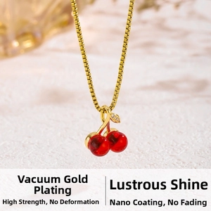Macro detail of red cherry pendant with vacuum gold plating and nano spray finish