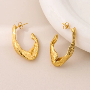 Chic 18K gold-plated irregular textured C-shaped earrings on a white ceramic background