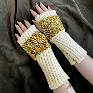 Detail of fingerless knit gloves featuring colorful butterfly jacquard patterns