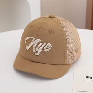 Detail of kids mesh baseball cap with NYC embroidery and breathable khaki fabric