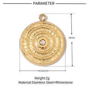 Detailed view of a 15mm gold stainless steel round pendant with a rhinestone center