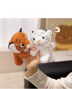 Detail of cute white and orange plush tiger slap bracelets with fine chain embroidery