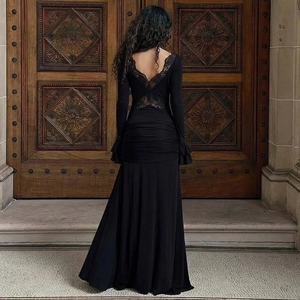 Elegant back view of black lace maxi dress featuring V-back design and mermaid ruffle hem