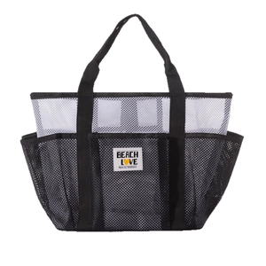 Black and white mesh beach bag with multiple pockets and Beach Love printed label