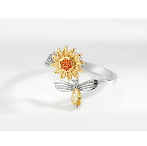 Detailed view of spinner sunflower and bee design on a silver adjustable open ring
