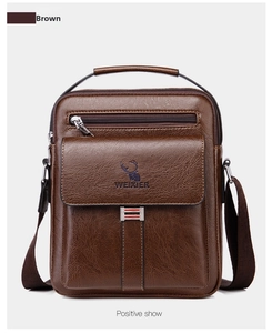 Close-up of brown leather crossbody bag with pebble texture and metallic buckle detailing
