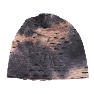 Tie-dye distressed knit beanie hat with ripped details for outdoor skiing and street style