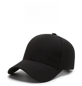 Detail of the black cotton baseball cap showing the side SPORT metal emblem and stitching