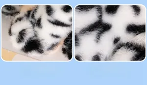 Detail of skin-friendly plush texture and cute paw design on the snow leopard toy