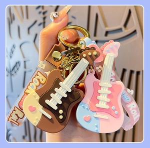 Detail of colorful rock and roll guitar silicone keychains for creative backpack charm