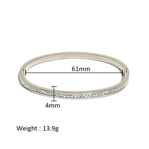 Detail showing 61mm inner diameter and 4mm width of silver plated bangle with pave crystals