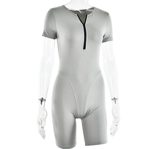Detail view of grey short sleeve bodycon romper with front black zipper closure
