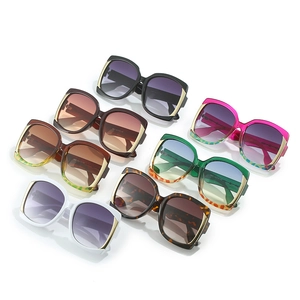 Collection of oversized square sunglasses in assorted colors with gold metal accents