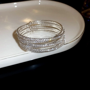 Detailed view of silver zircon flower double-layer bracelet with sparkling stones