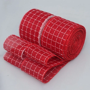 Close-up of red and white checkered burlap ribbon for Christmas gift packaging