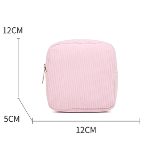 Pink corduroy mini cosmetic bag with gold zipper and dimensions 12x12x5 CM shown clearly
