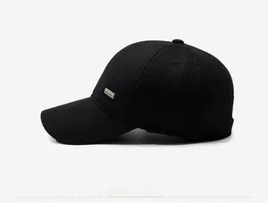 Side view of men's winter wool baseball cap with thick twill texture and metal logo