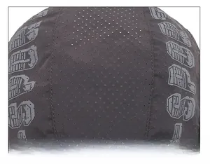 Detailed top view of dark grey quick-dry beret featuring laser-cut breathability holes