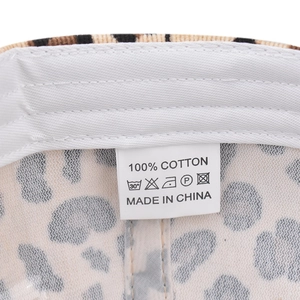 Detail of 100% cotton lining and leopard print texture on the baseball cap interior