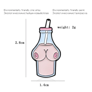 Close-up of a pink and blue milk bottle enamel pin with creative anatomical features