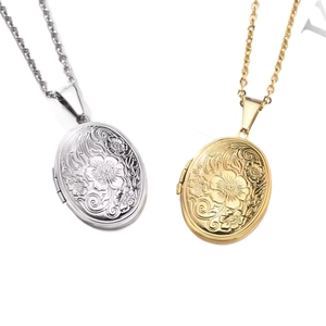 Vintage floral engraved oval locket necklace in polished gold and silver stainless steel