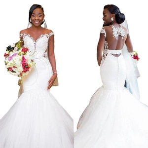 Elegant mermaid wedding dress with off-shoulder lace bodice and tulle fishtail skirt