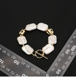 Baroque irregular pearl bracelet with 18k gold toggle clasp and rectangular flat pearls