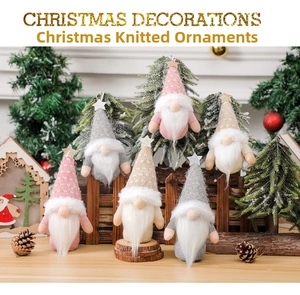 Close-up of knit Christmas gnomes with star hats and long beards for holiday decor