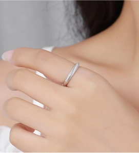 Close-up of a sterling silver Mobius ring with double-row diamonds on a hand